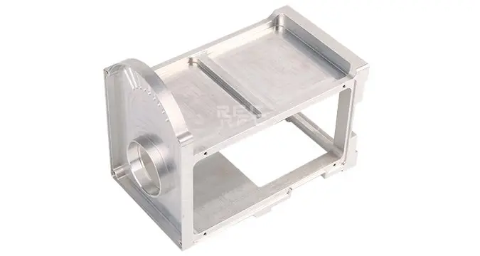 What are the core components of a CNC machining center?